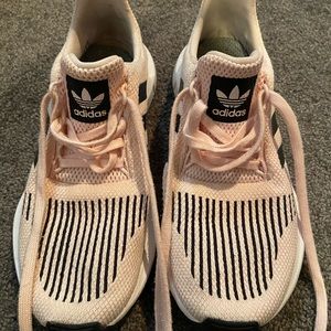Blush pink and black striped Adidas sneakers
